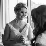 bridesmaid smiling at the bride in the Forthview Suite
