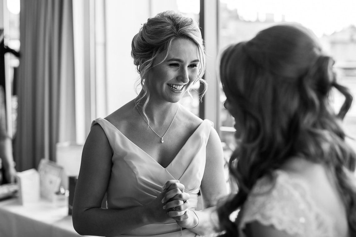 bridesmaid smiling at the bride in the Forthview Suite