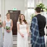bride smiles as celebrant announces the new Mr and Mrs