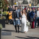 newlyweds walking along George STreet