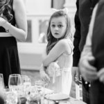 young guest watches King's Hall entry of the top table guests