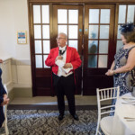 Toastmaster Maurice King announces the newlyweds into the King's Hall