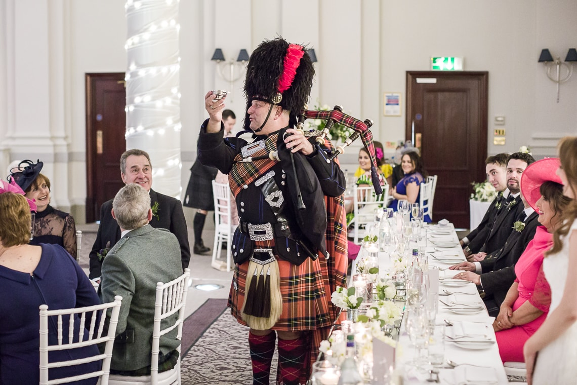 piper toast to the newlyweds in the King's Hall