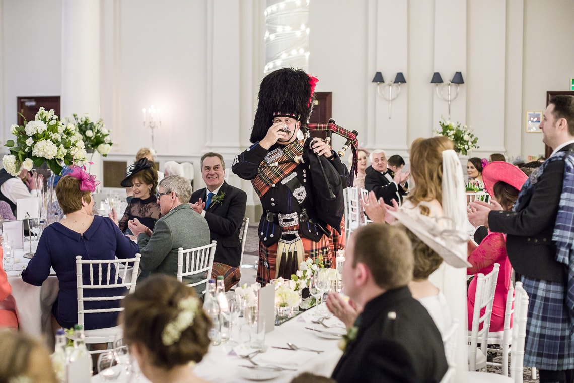 piper toast to the newlyweds in the King's Hall