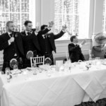 the best men raise a toast in the King's Hall