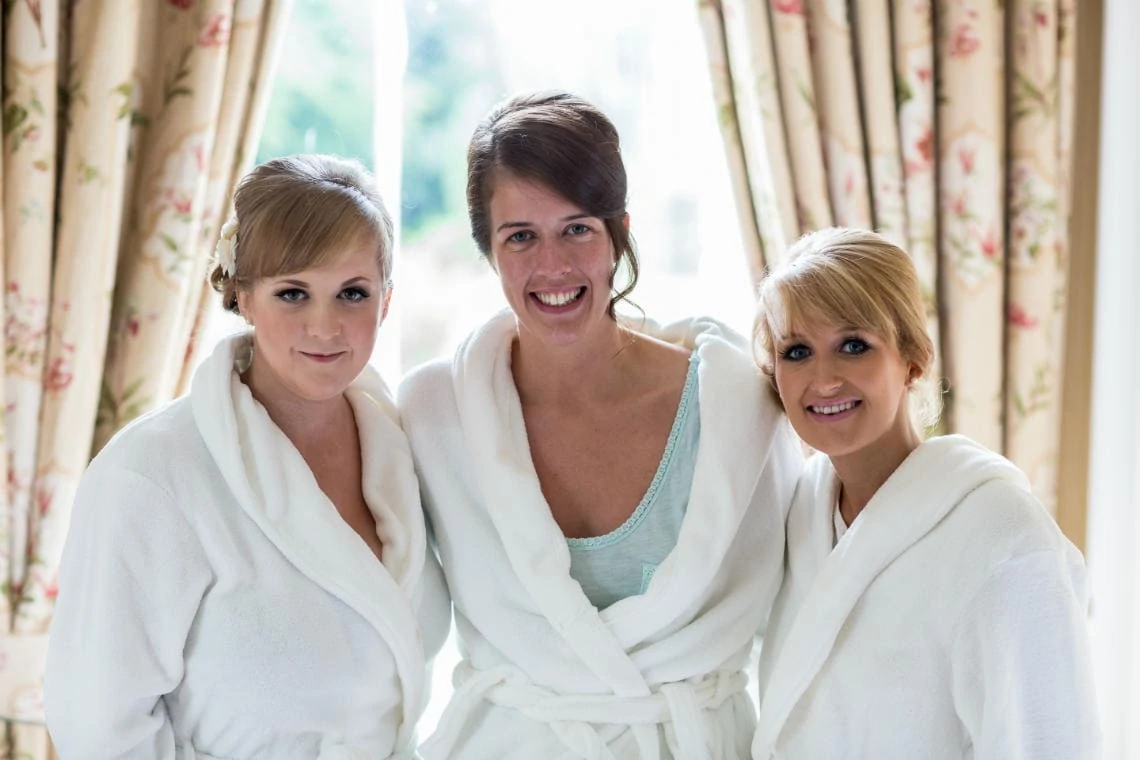 bride and bridesmaids in dressing gowns