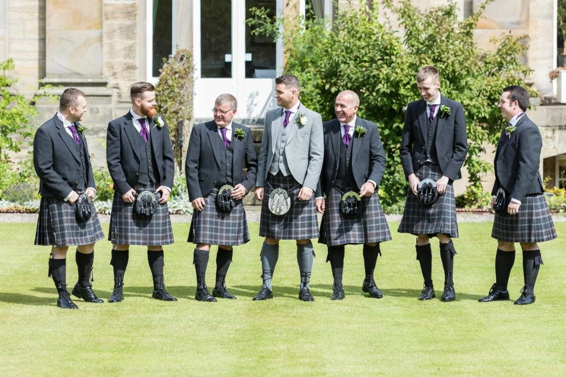 Groom and the boys on the lawn