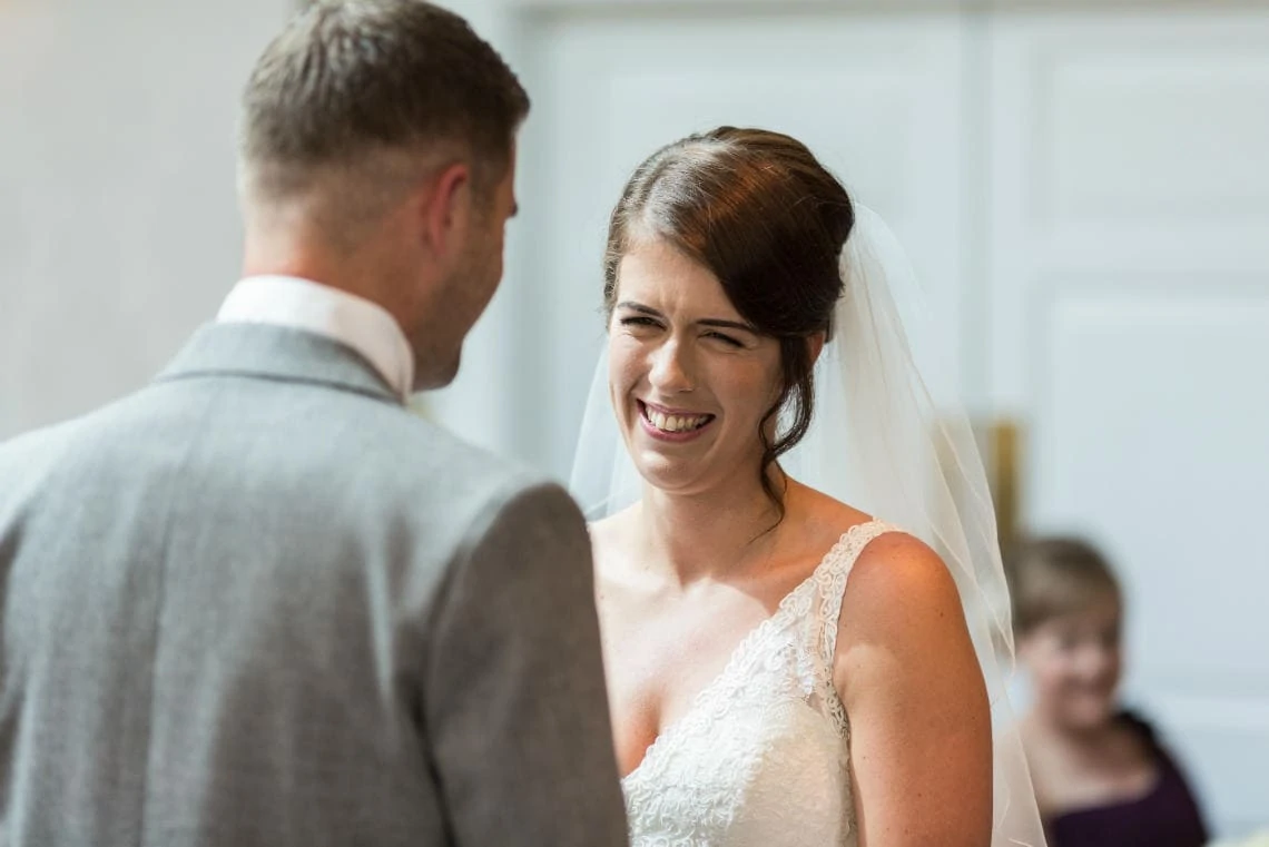 bride smiles at groom during Humanist ceremony in The Ballroom