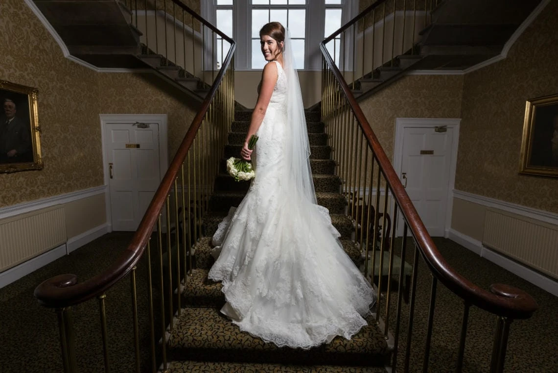 bridal pose on the staircase