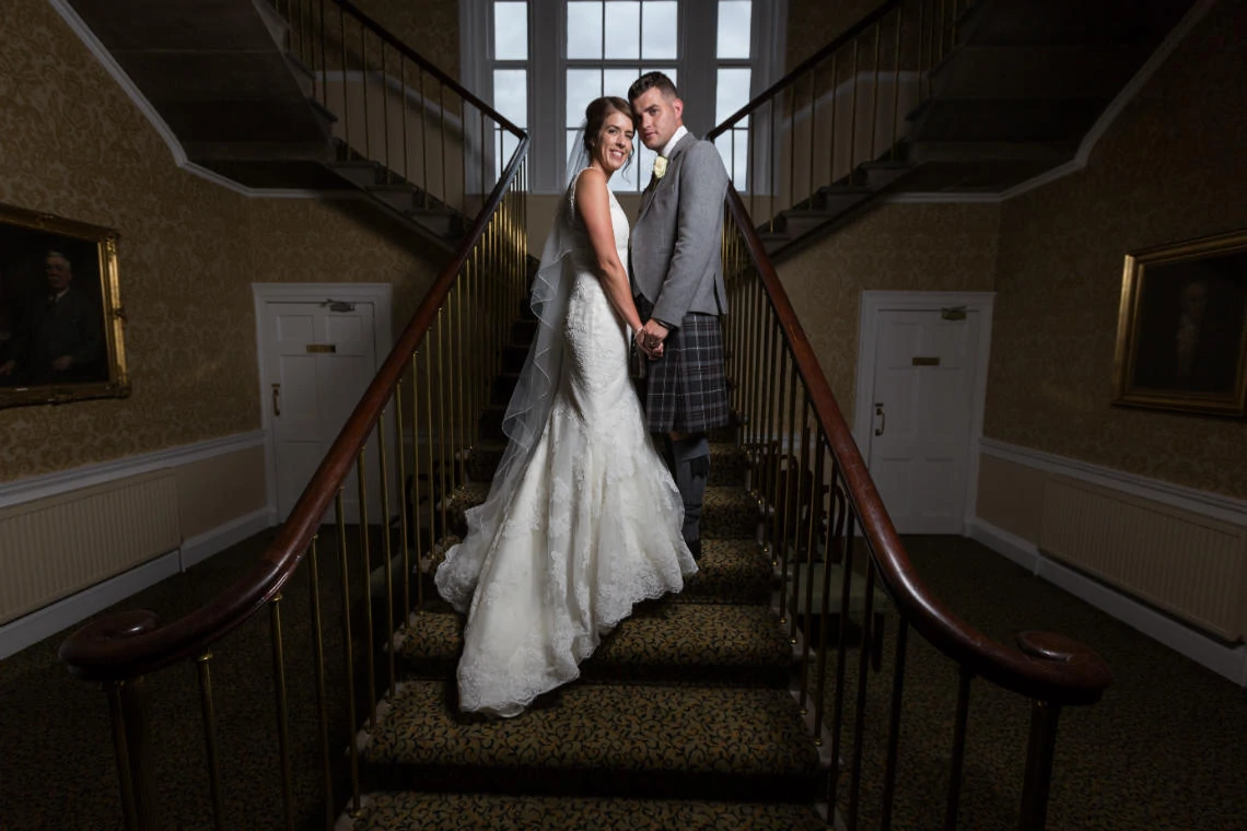 newlyweds on the staircase