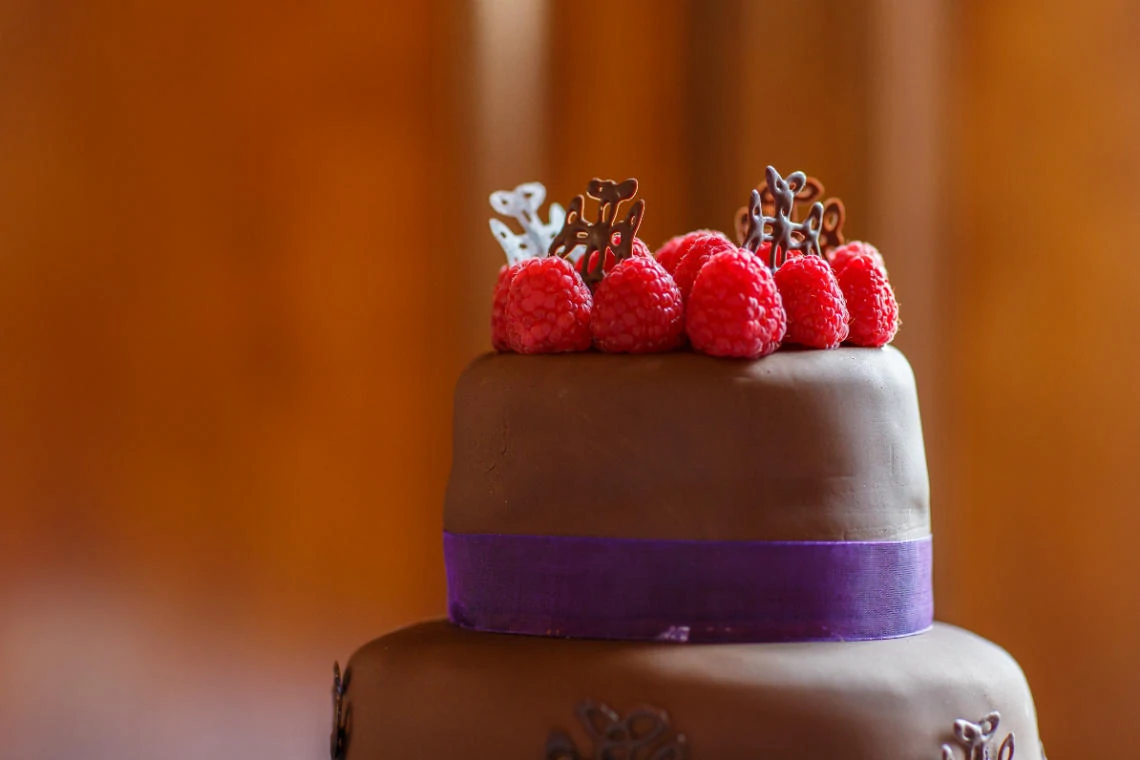 chocolate and raspberry cake with purple ribbon in the Ramsay Suite