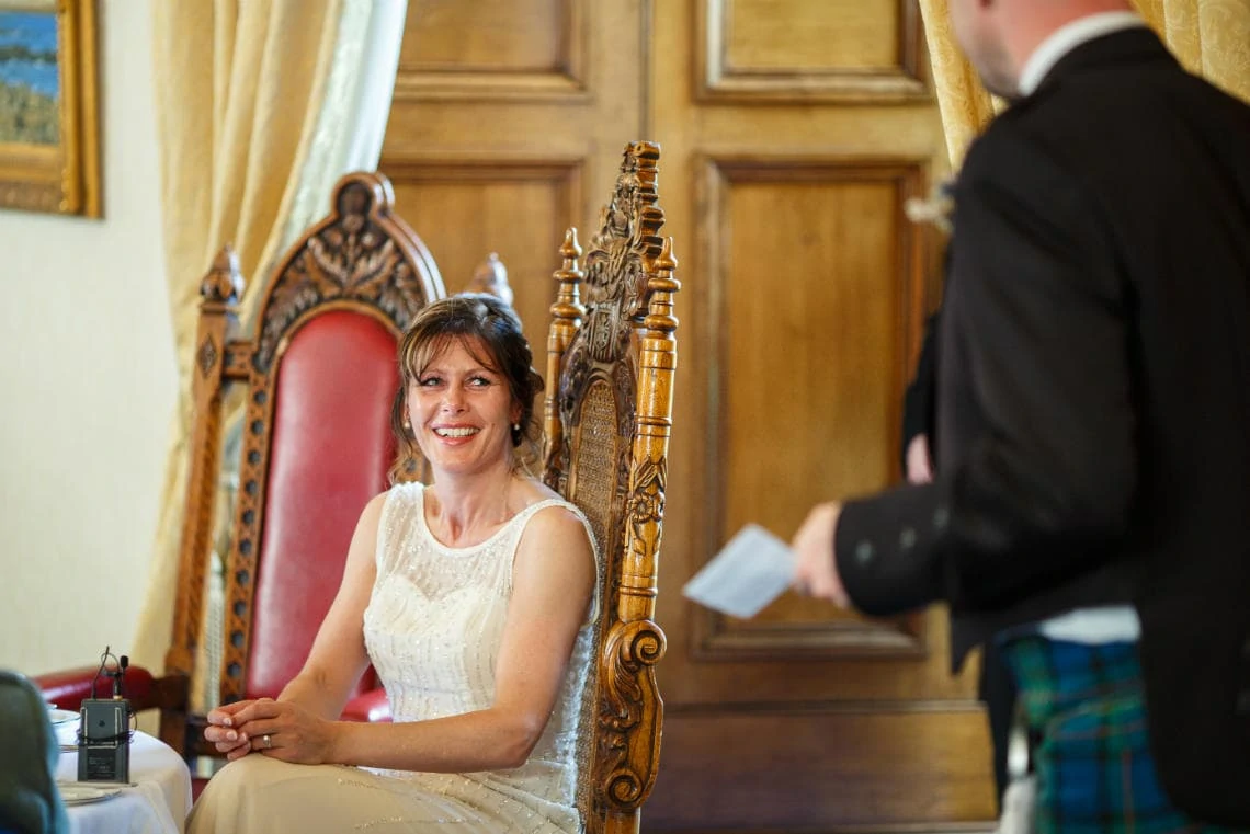 bride smiling during groom's speech in the Ramsay Suite