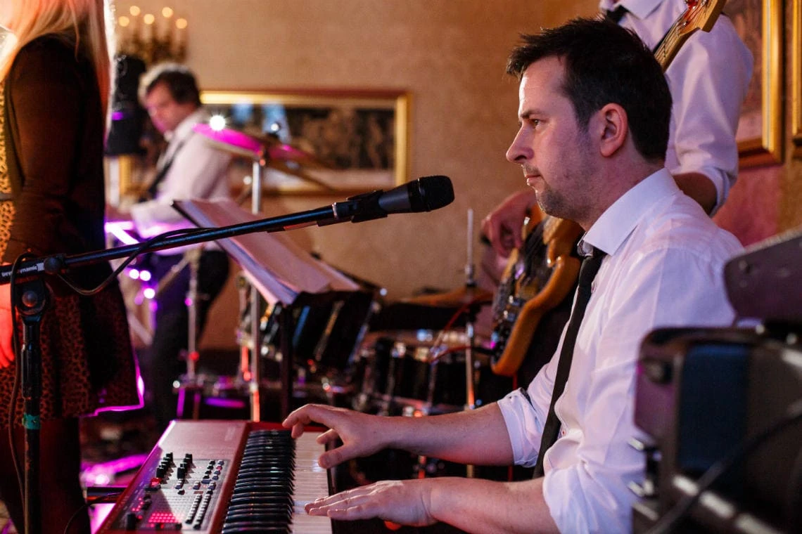 keyboard player with The Saturns band during evening reception in the Sir Alexander Room