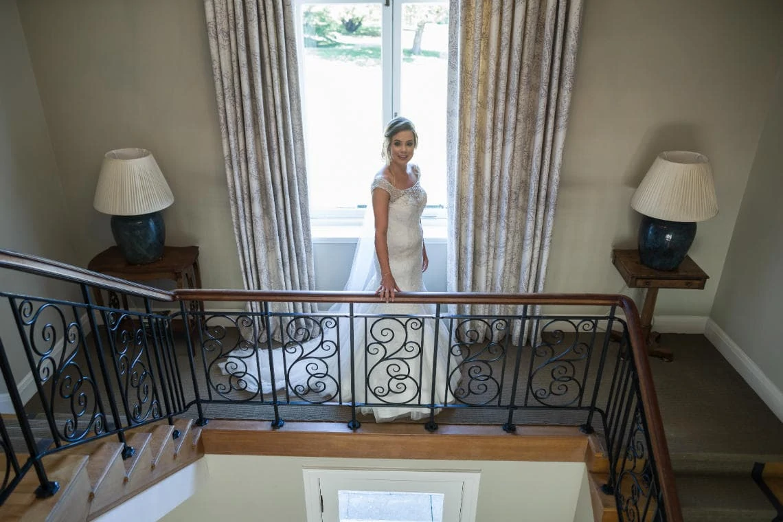 bride on staircase of house