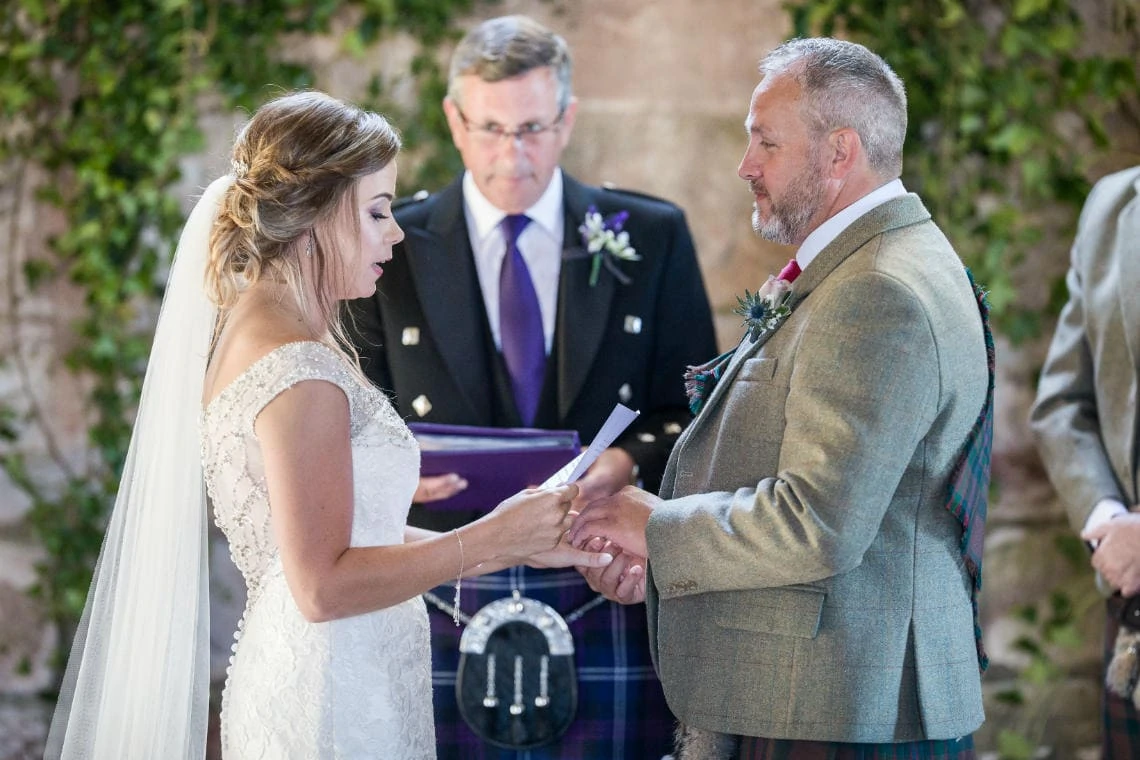 bride reading vows during ceremony in church