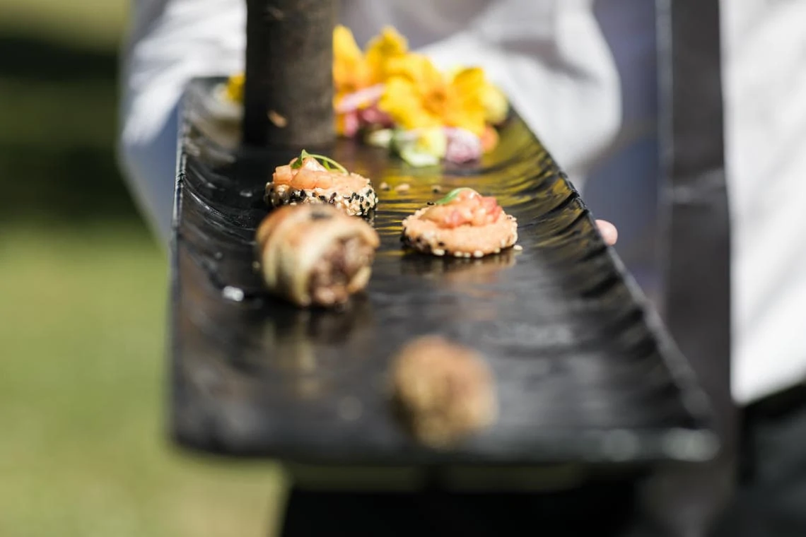 canapes being served on a black platter