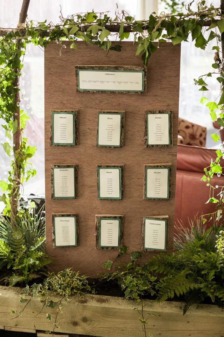 wooden table plan with green foliage