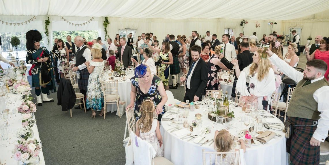 wedding guests during toast at reception