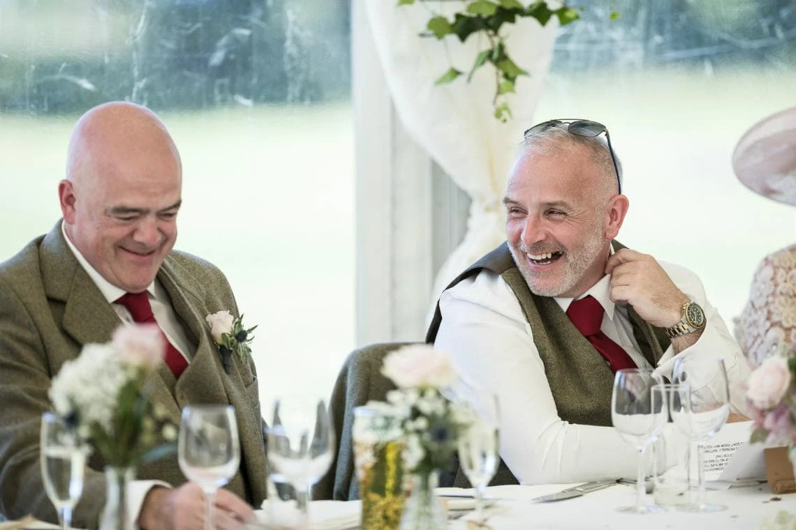 best men laughing during groom's speech