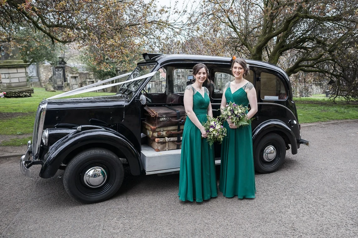 bridesmaids standing beside wedding car old Beardmore Taxi