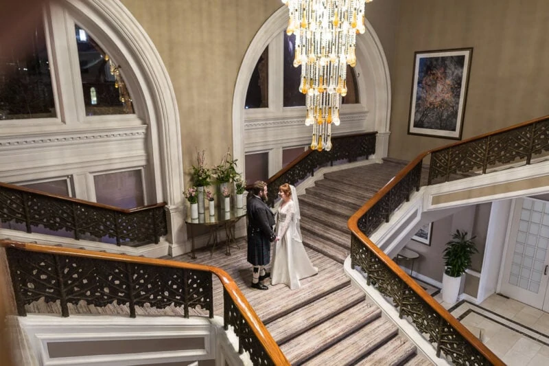 Waldorf Astoria Edinburgh The Caledonian - newlyweds on the grand staircase
