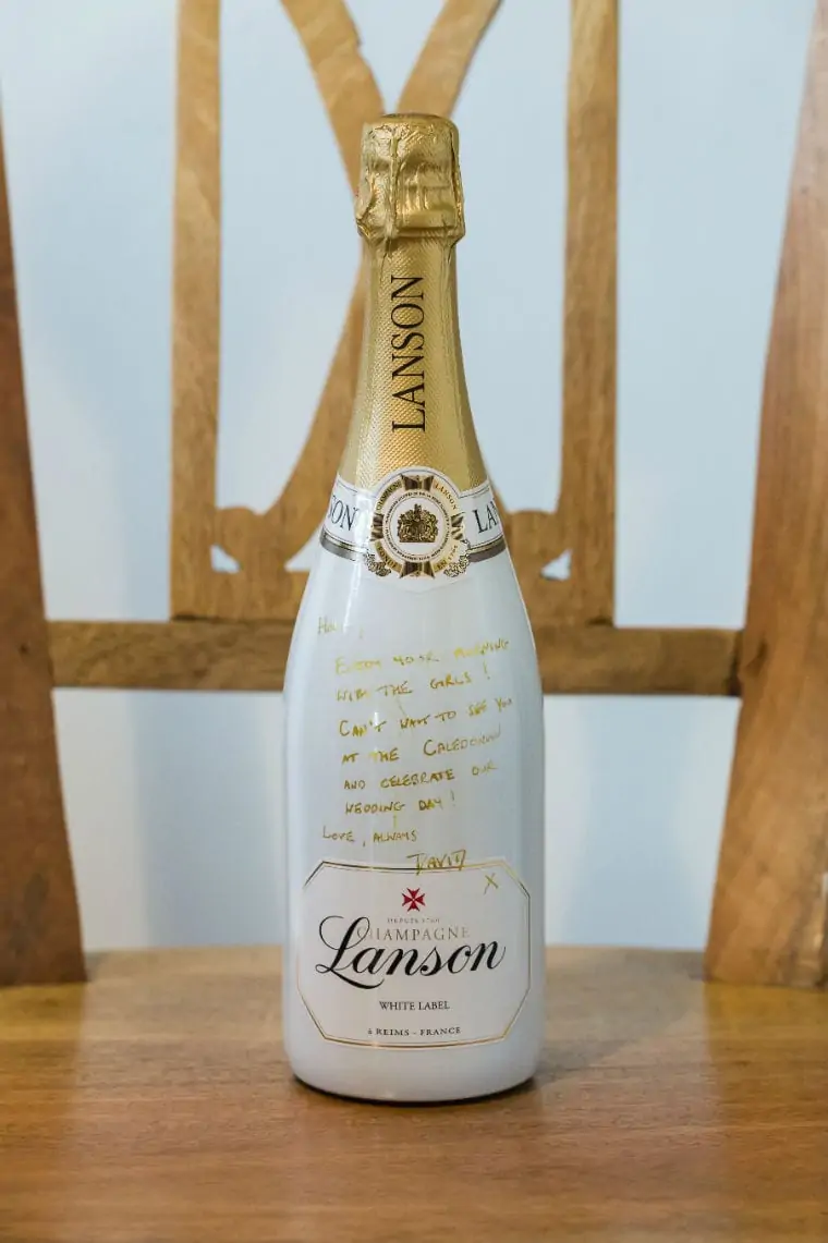 Champagne bottle with handwritten message from the Groom