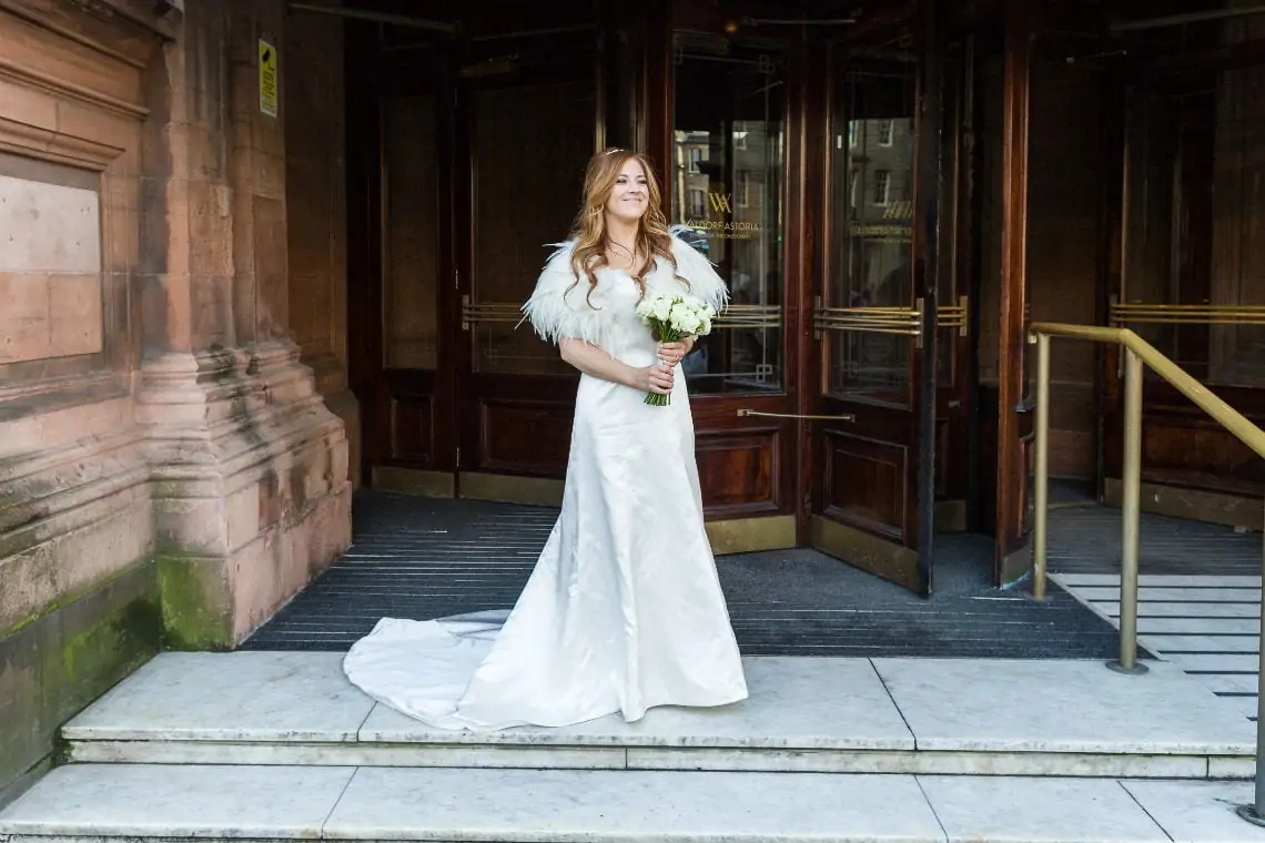 Bride at the entrance to the hotel