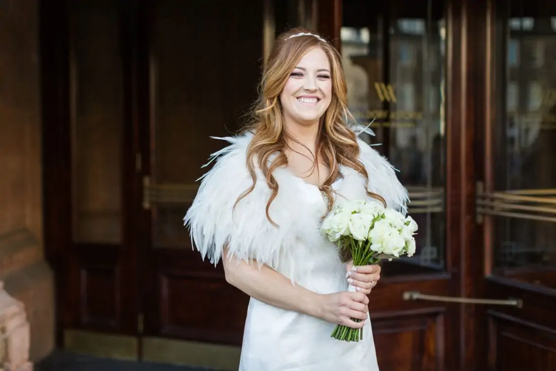 Portrait of bride at the entrance to the hotel