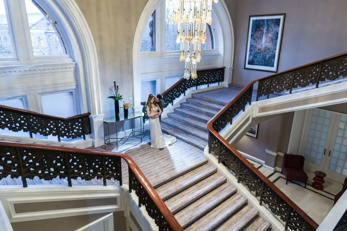 Bride and Groom on grand staircase taken from above