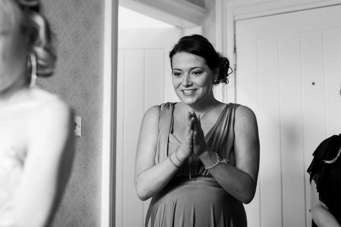 black and white photo of bridesmaid smiling