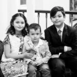 black and white photo of three children at wedding