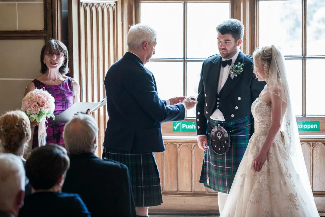 father of the groom passing quaich to groom