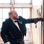 photo of bestman holding owl