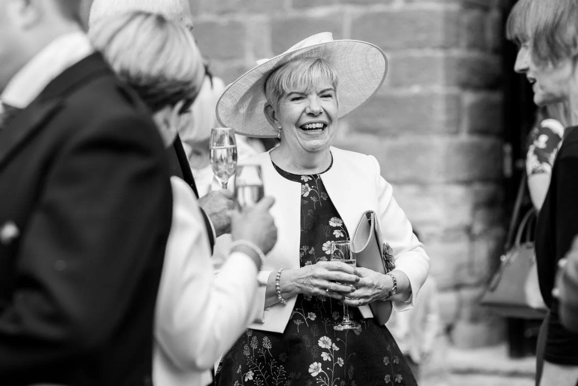 photo of mother of the groom smiling during drinks reception
