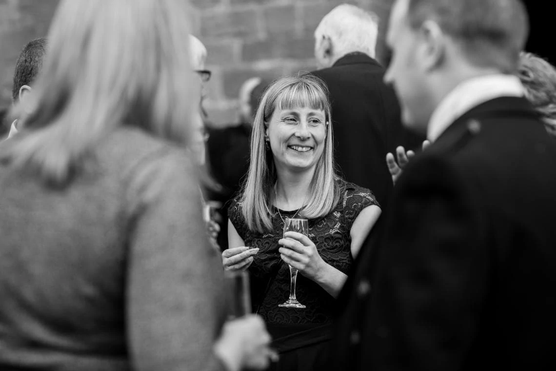 guest smiling during drinks reception