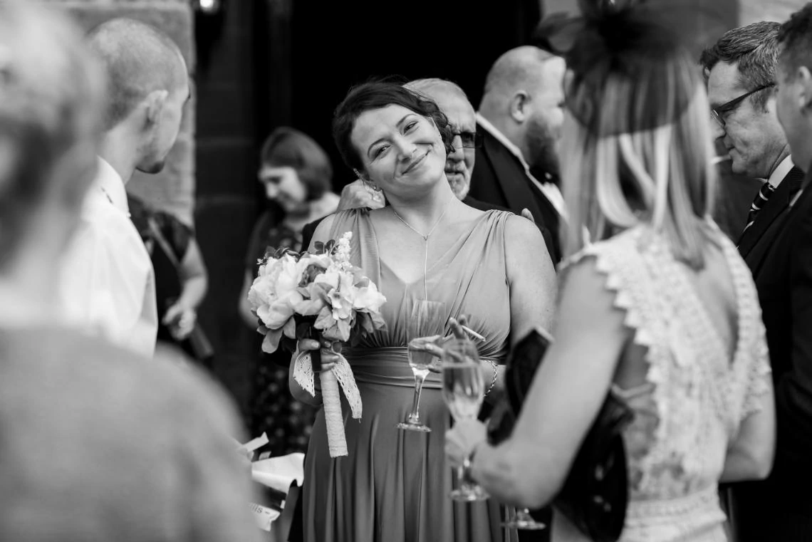 bridesmaid smiling during champagne reception