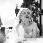 Bride laughing during speeches