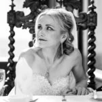 bride at top table during wedding speeches at wedding reception
