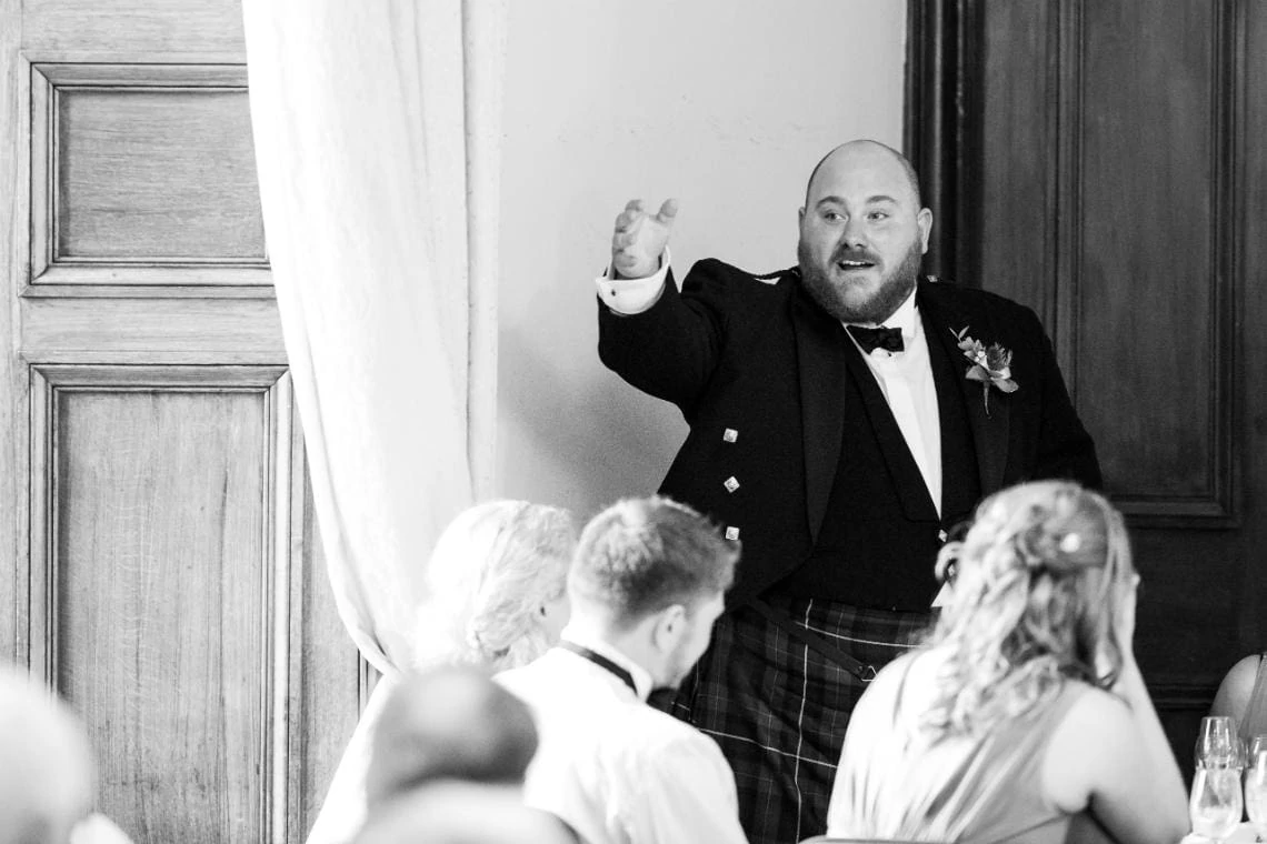 best man doing speech during wedding reception