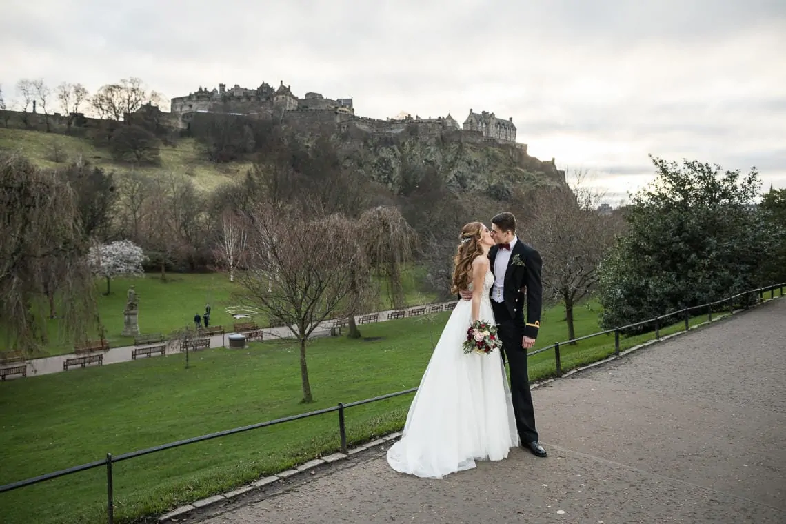 newlyweds in Princes Street Gardens with Edinburgh Castle in the background
