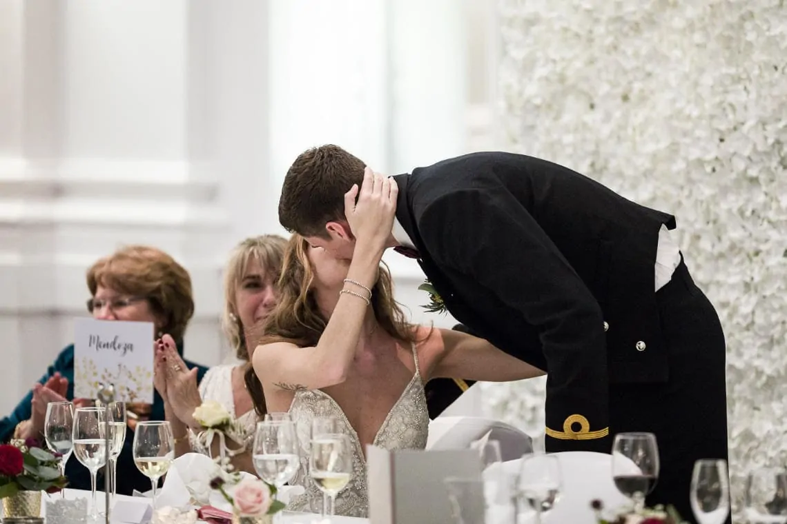 bride kisses the groom after his speech