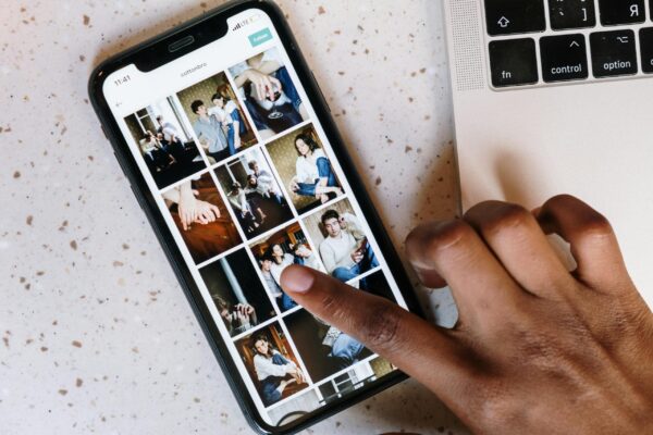 Advice for an unplugged wedding ceremony in Edinburgh - stress-free wedding tips. Person tapping a smartphone screen.