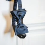 bow tie hanging over door handle