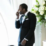 Groom wipes a tear during Humanist ceremony