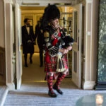 Pipe Major Iain Grant leads newly-weds to the champagne reception