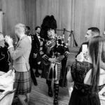 Pipe Major Iain Grant pipes newly-weds into The Boardroom