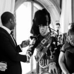 Pipe Major Iain Grant toasts newly-weds in The Boardroom